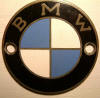 The BMW emblem with copper letters and is correct for all bikes from the middle 50's till the early 60's.  I don't remember when the copper ended and the silver color started.  Any evidence/proof would be welcomed.