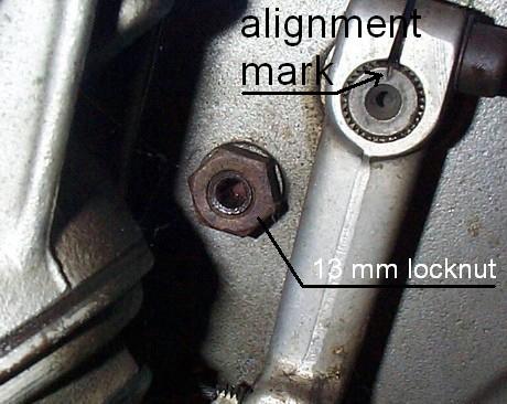 This photo shows a close up of the slash 5 BMW motorcycle front brake backing plate. The important adjustments are shown.