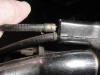 This shows the cable carefully pulled back to allow the cover to come up or off.